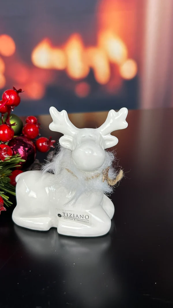 Deko Rentier Lars sitzend 8,5cm cremeweiß Deko Rentier Lars sitzend 8,5cm cremeweiß